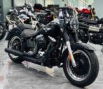 Подержанный мотоцикл Harley-Davidson Fat Boy 103 2016 года, пробег 17000 км, вид сбоку, прозрачный фон